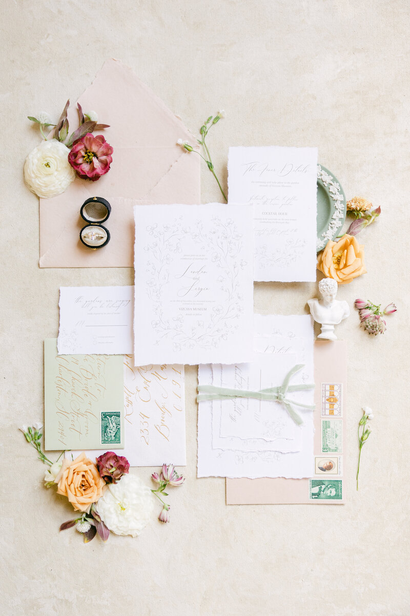 A beautifully styled wedding invitation suite for an elegant celebration at Middleton Place in Charleston, SC. Featuring delicate calligraphy, vintage stamps, and soft floral accents for a timeless and sophisticated wedding aesthetic.