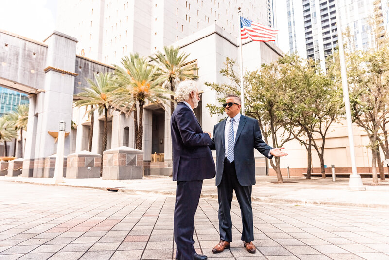 two men talking at courthouse