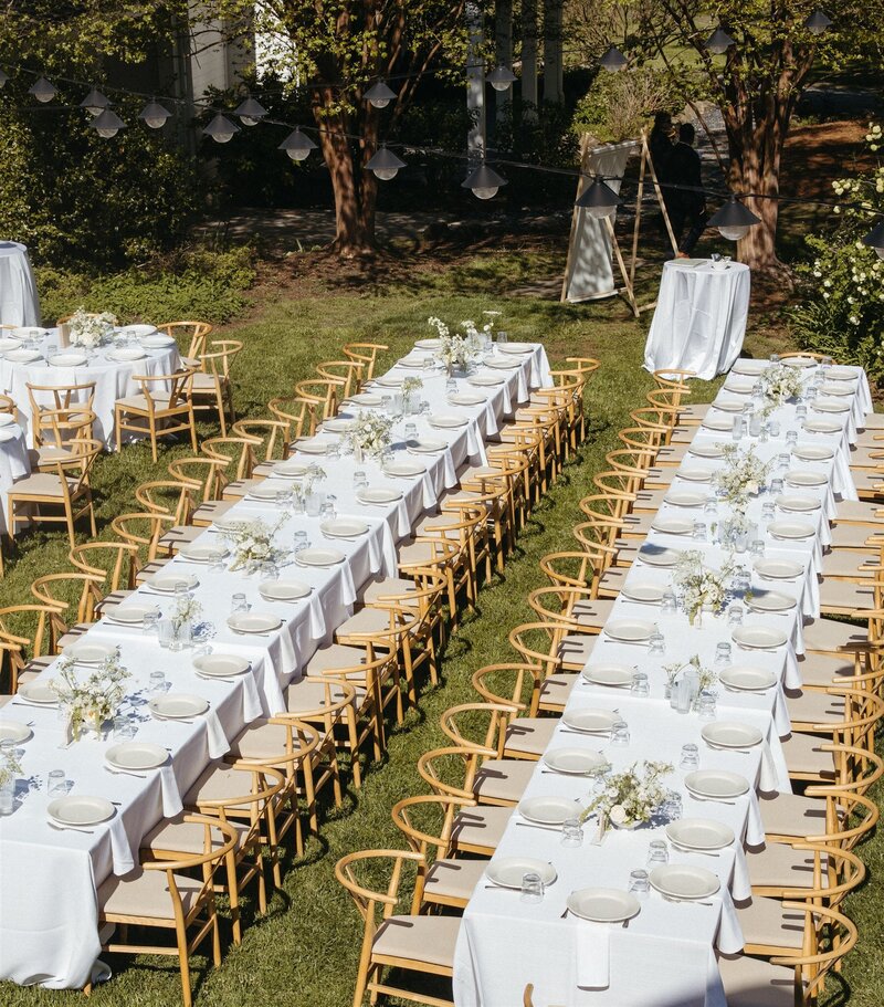 Bride and groom kissing during outdoor wedding ceremony
