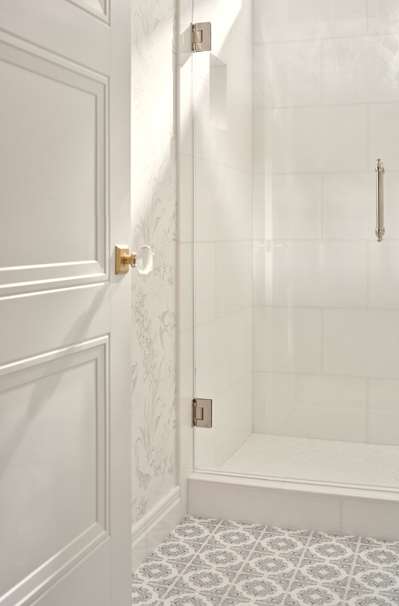 guest bathroom with white door and glass door handle