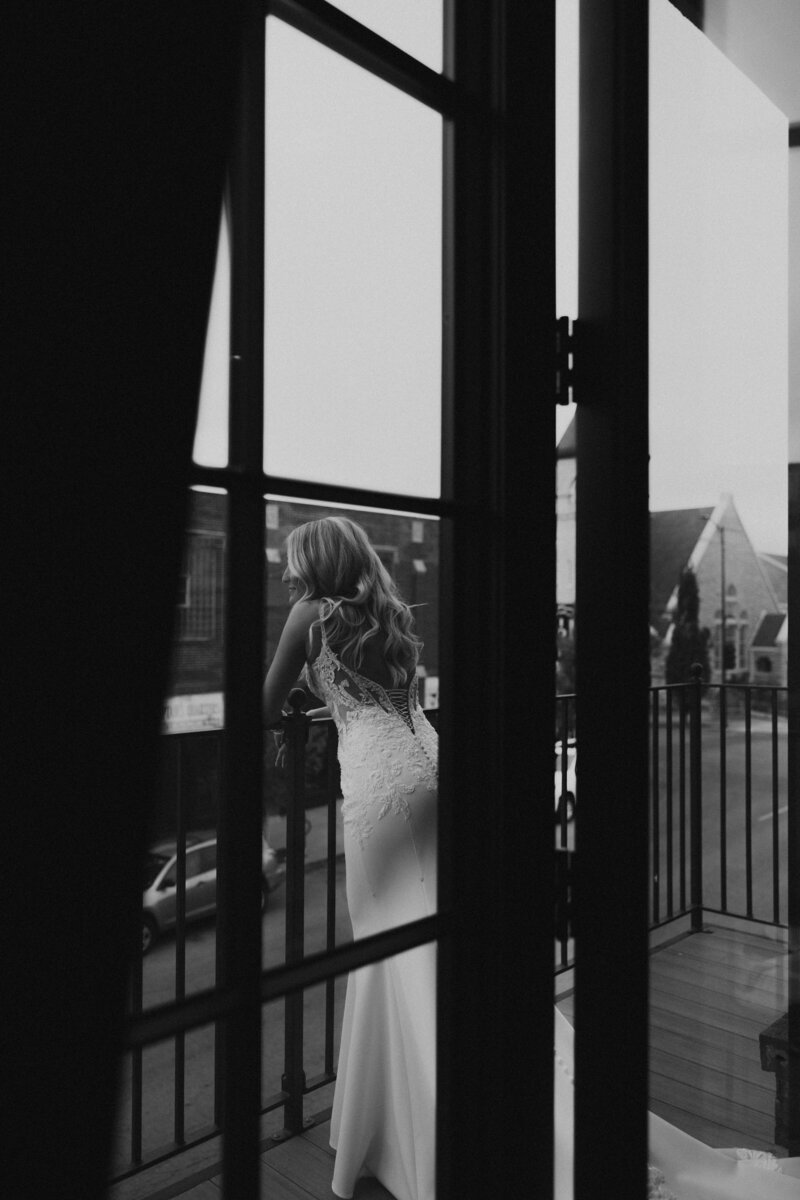 downtown hotel bride portraits in getting ready suite. adding film to your wedding day can be added on in wedding packages.