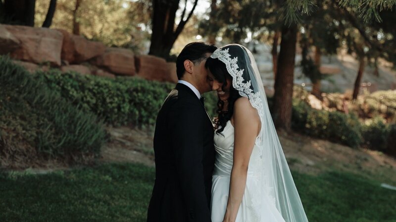 A couple shares a laugh on their wedding day captured by Sierra Lee Films in Lake Las Vegas