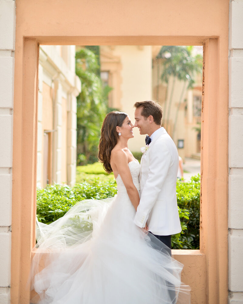 Elegant wedding couple portrait in a lush Miami garden setting by Rodrigo Varela Photography.