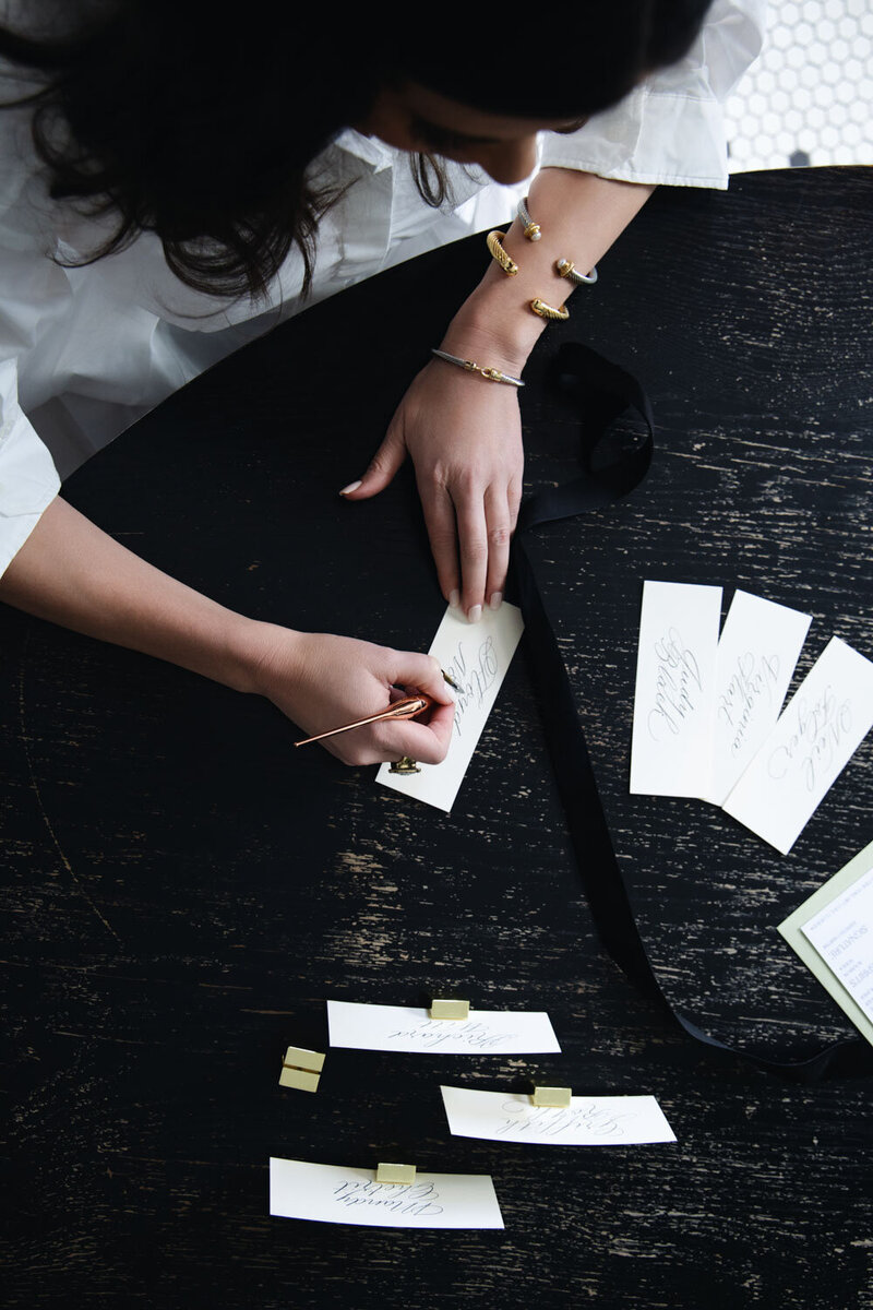 Calligrapher writing elegant place cards