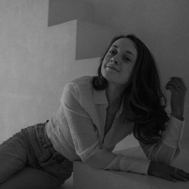 Chelsea Gurr sitting on chair looking to the side