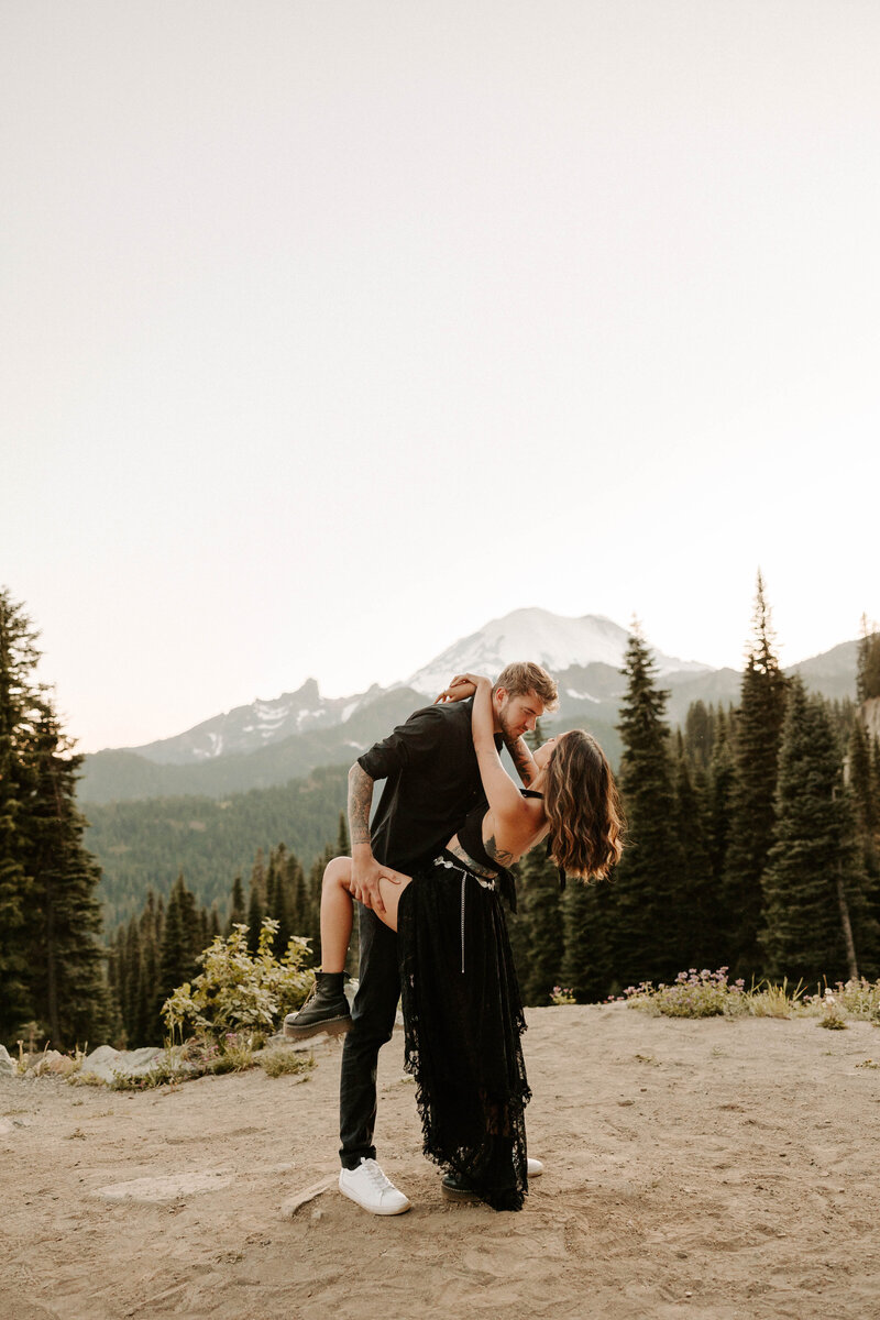 couple embracing with the mountains in the backdrop near nashville