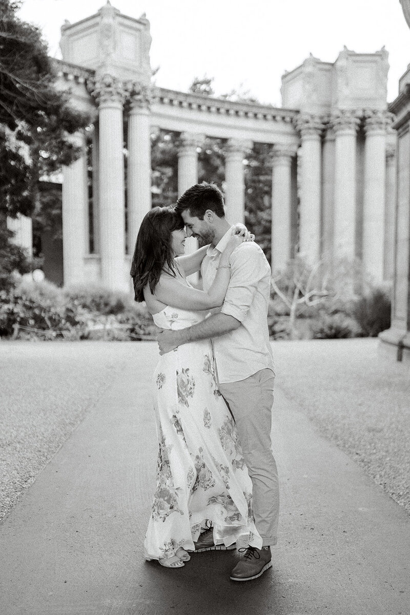 A couple shares a romantic moment at the historic Greystone Mansion in Beverly Hills, California, captured by Tiffany Longeway Photography.