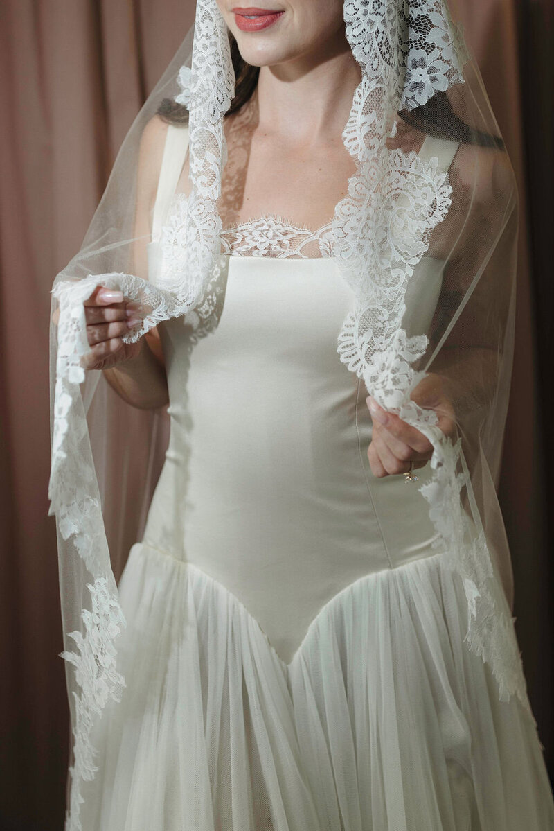 bride wearing white satin slip dress