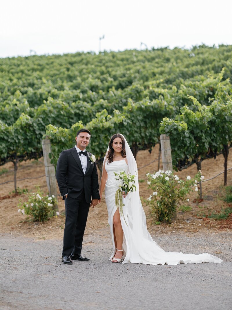 Bride and groom formal portrait at a black tie vineyard wedding