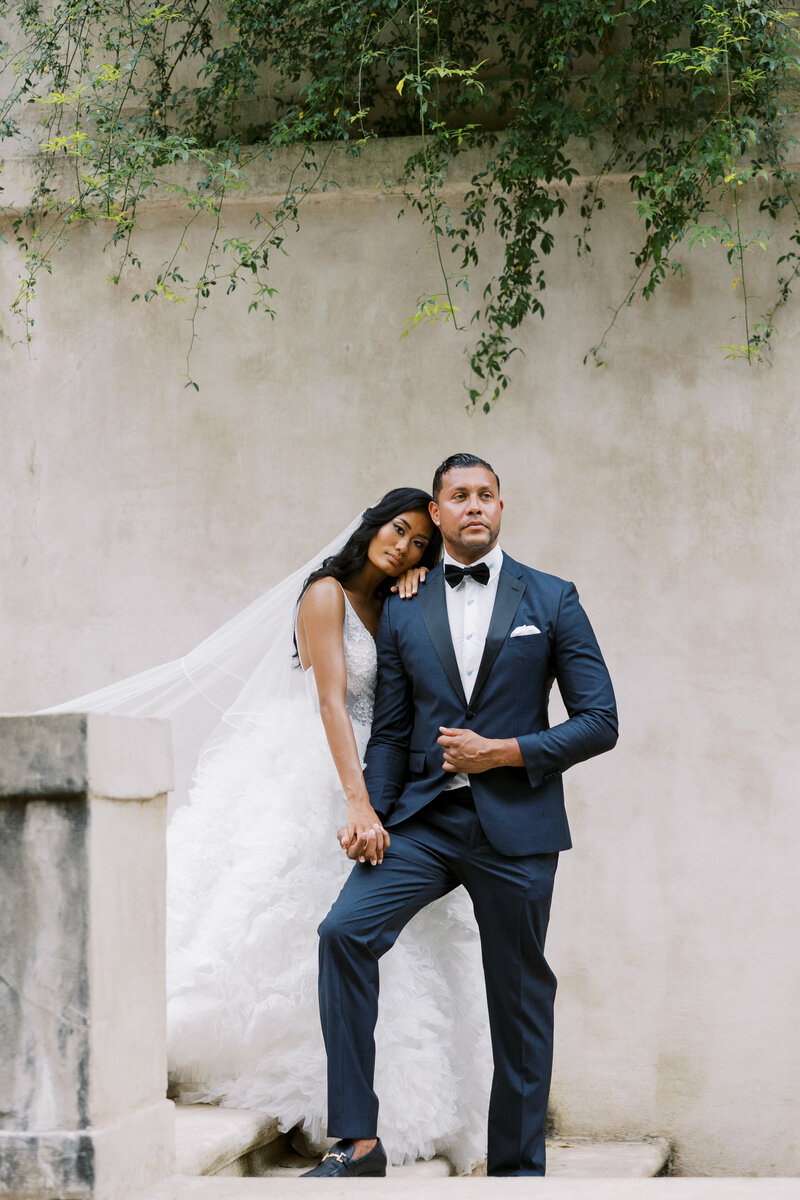 Bride and groom walk up memorial steps at their DC wedding