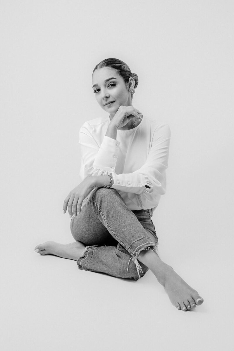 Black and white portrait of Amia Marcell, a luxury wedding photographer specializing in editorial and timeless wedding photography across the U.S.