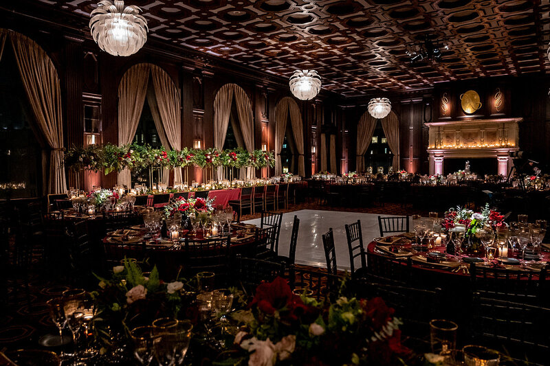 San Francisco wedding photographer captures elegant reception at Julia Morgan Ballroom with dramatic coffered ceiling and crystal lighting