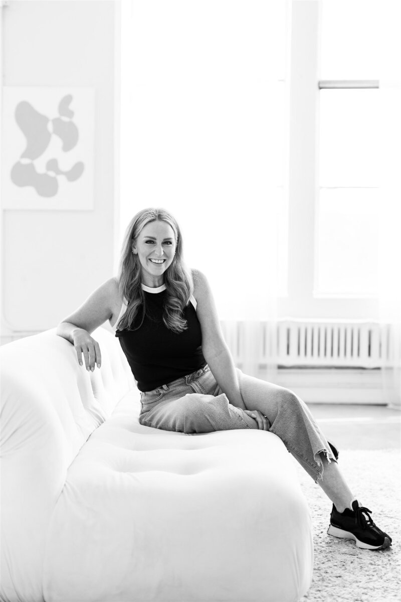 wedding photography business coach sitting at desk