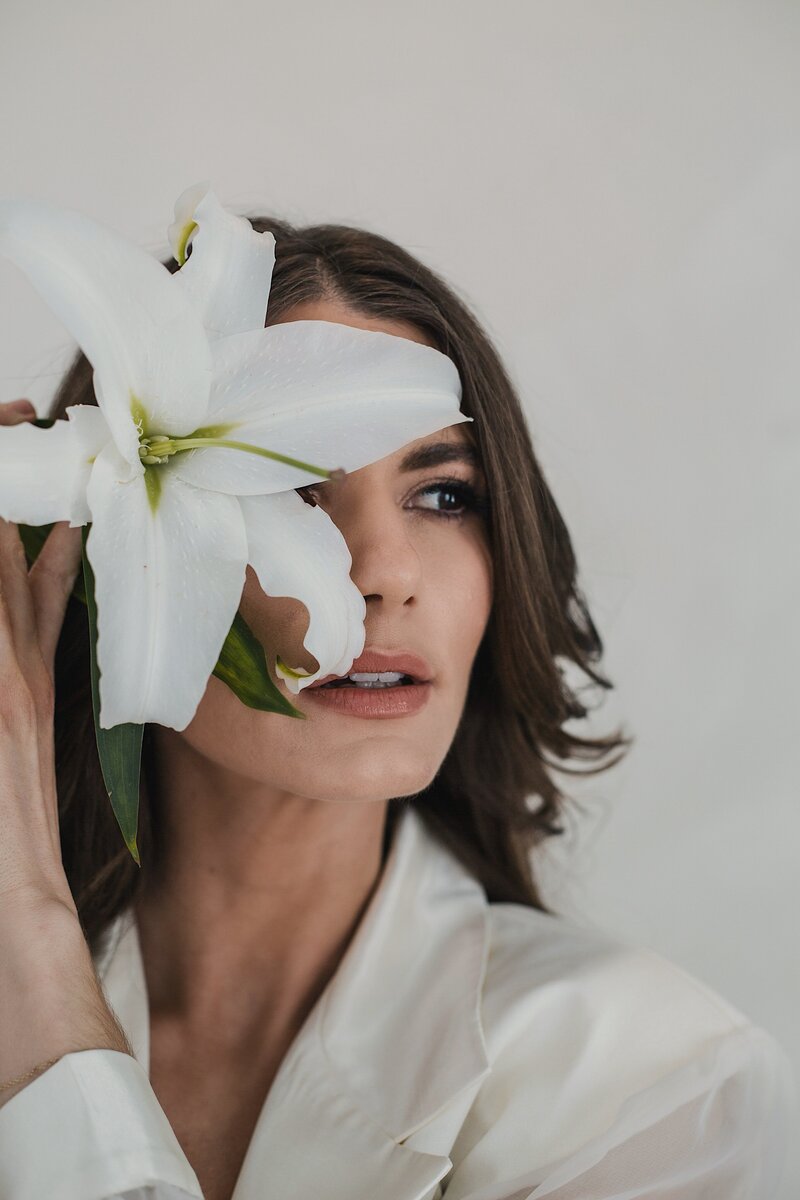 Studio portrait with flower taken in albuquerque new mexico.