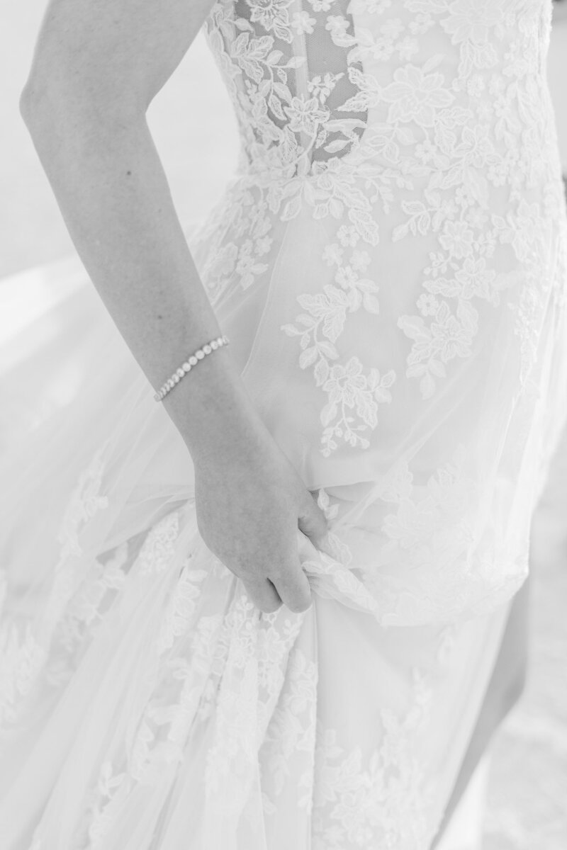 detail shot of bride holding her dress