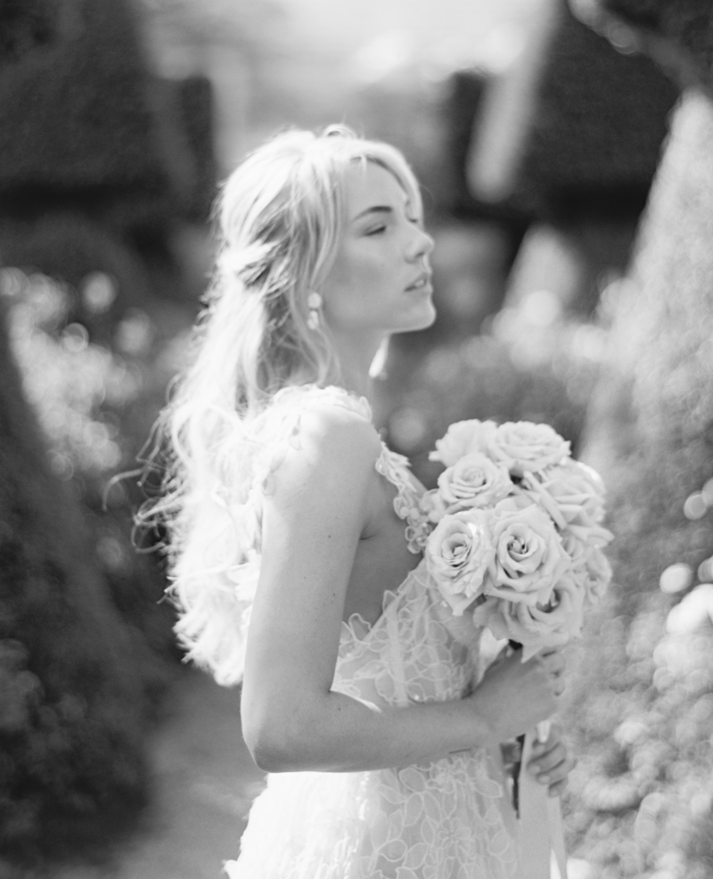 bride holding dress and laughing