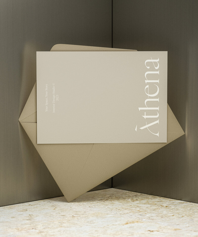 Elegant brand materials for Athena interior design studio, featuring custom envelope and refined printed stationery.