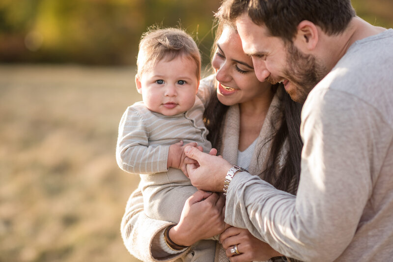 family holding their son