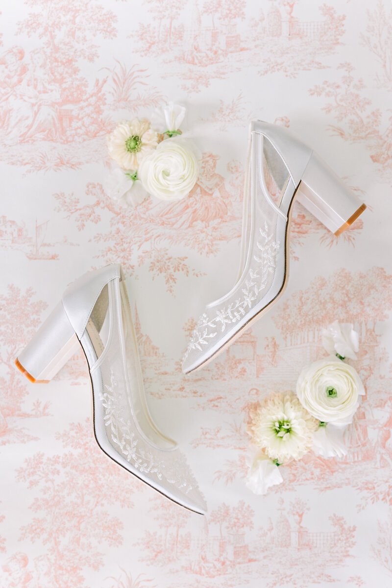 Flat lay of brides wedding heels