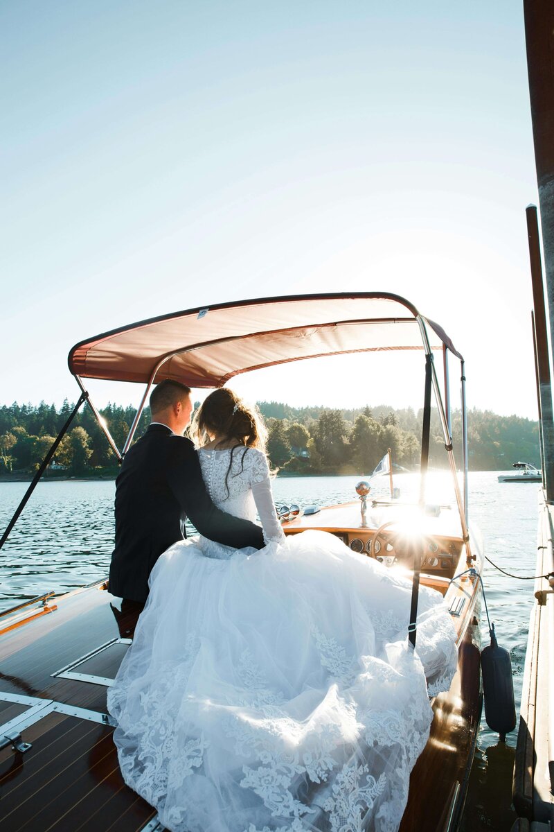 bride and groom on a lake