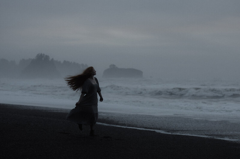 women walking on rialto beach in olympic national park nation park at sunset