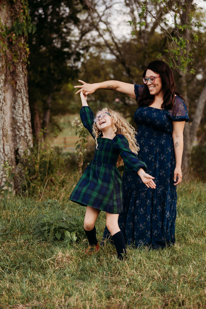 Girl dancing with mother during photoshoot in Franklin, Tennessee 