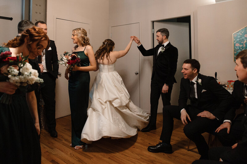bride being twirled by her groom candid moment