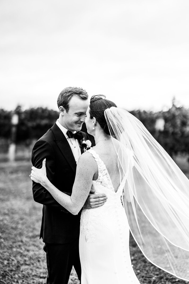 Black and white photo of a married couple gazing lovingly at each other