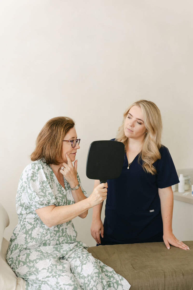 Dr Olivia James consulting a client on aesthetic treatments for natural results