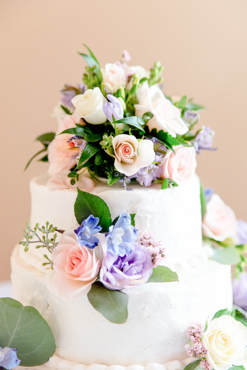 Spring colored 3 layer wedding cake with white frosting