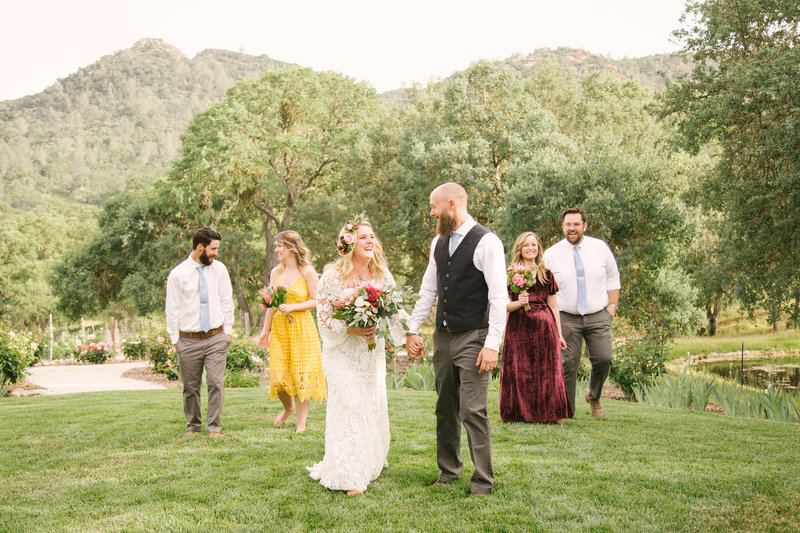 Bridal party laughs after wedding ceremony at Rancho Dos Amantes