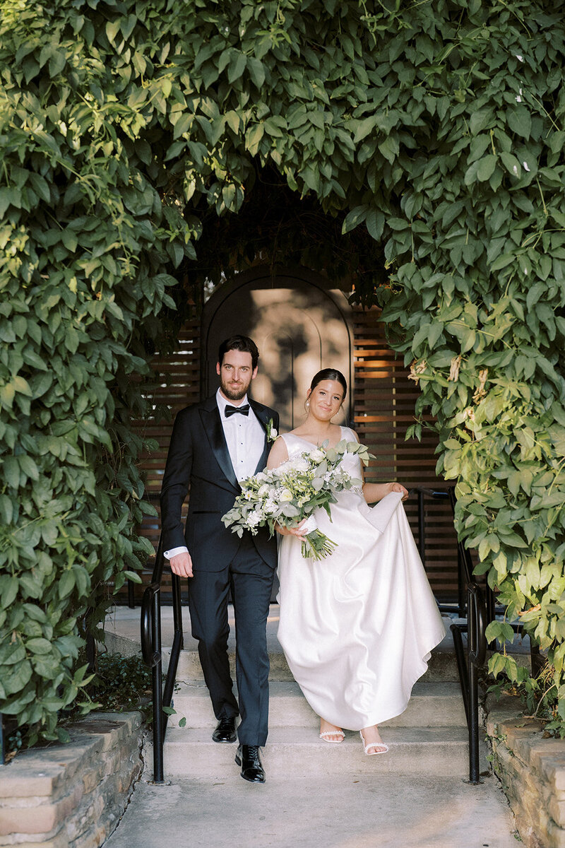 Newlyweds walking out of the wedding venue