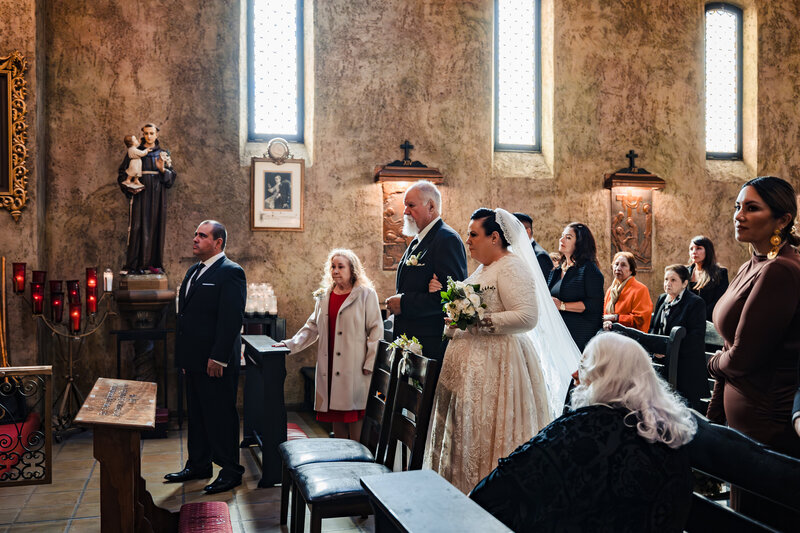 Catholic Bride walking down the isle at san Secondo di asti