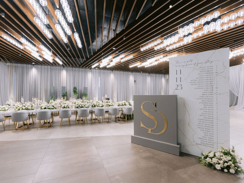 Elegant wedding reception tables with tall lush floral arrangements