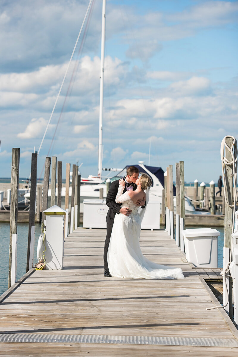 Michigan wedding bride and groom on pier with boats