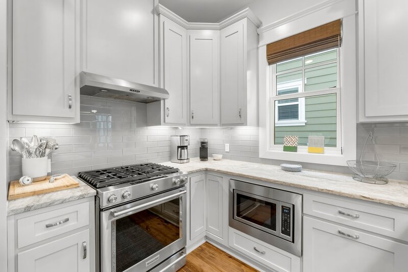 Bright open-concept kitchen and living area with seating and natural light at Tangerine Dream in Carillon Beach.
