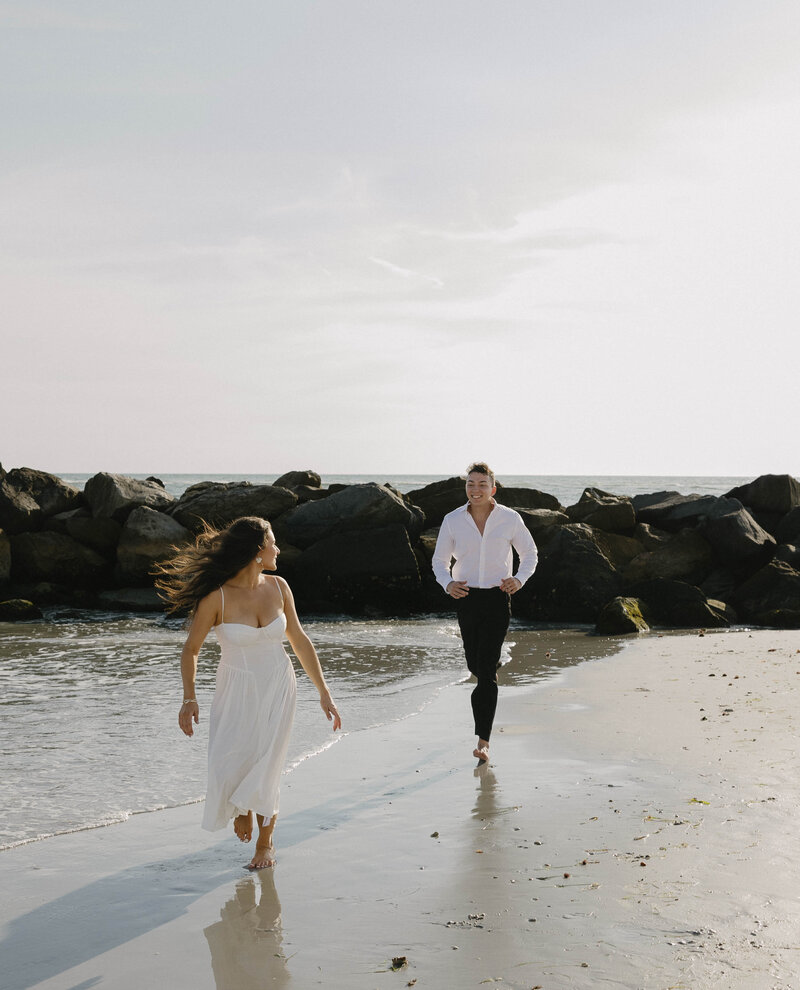 Ponce inlet bridal portraits on the beach on rocks for elopement