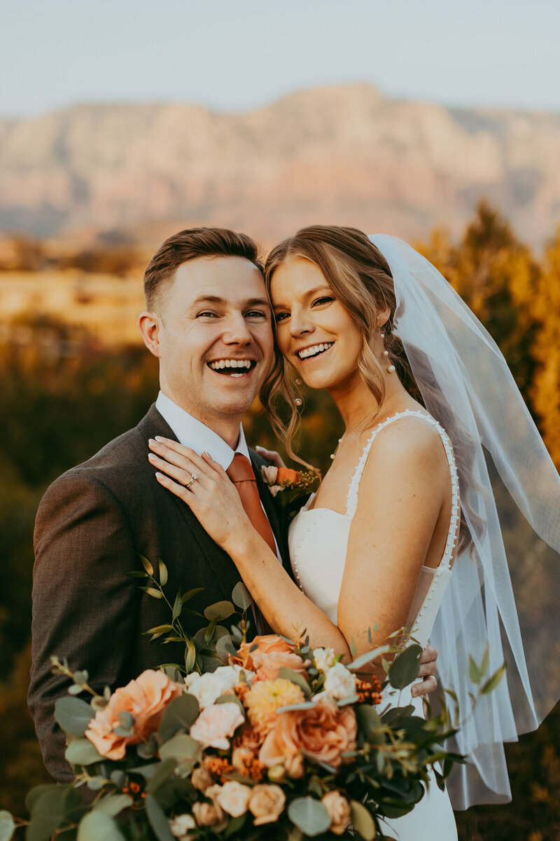 bride and groom smiling in sedona