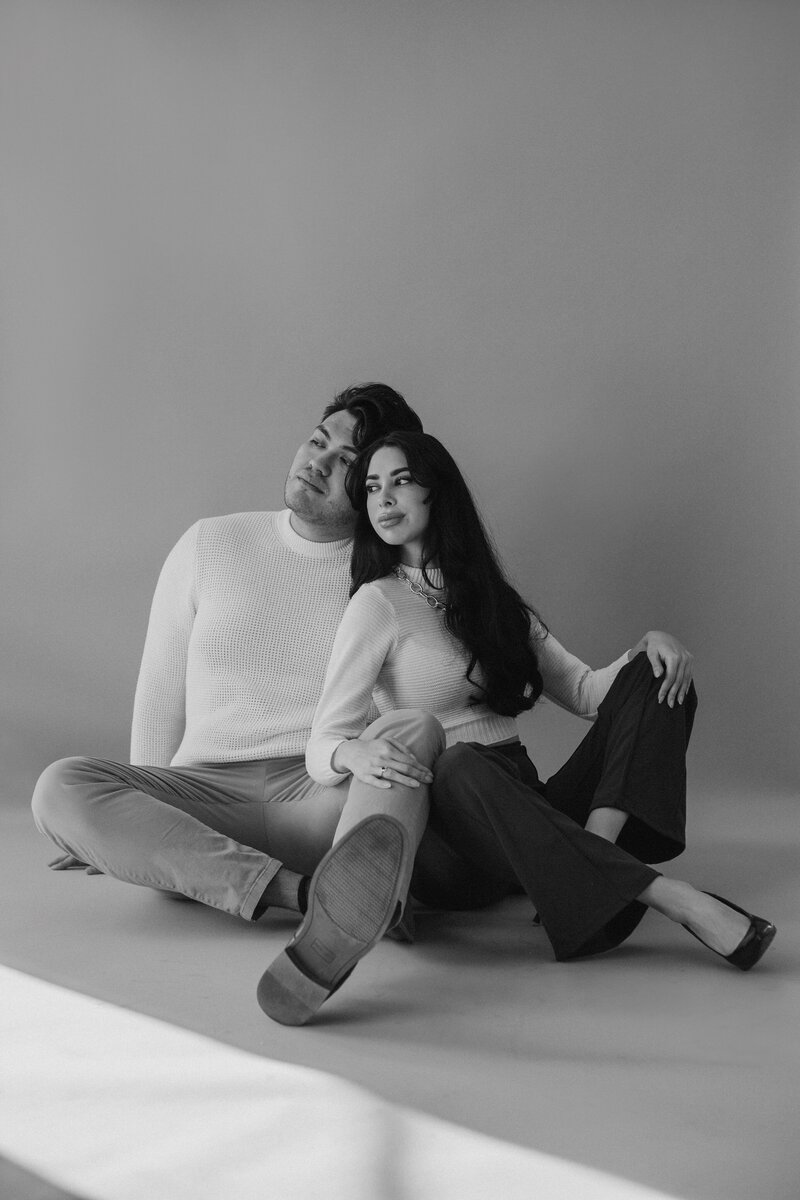 Couple seated together in couples photoshoot in albuquerque.