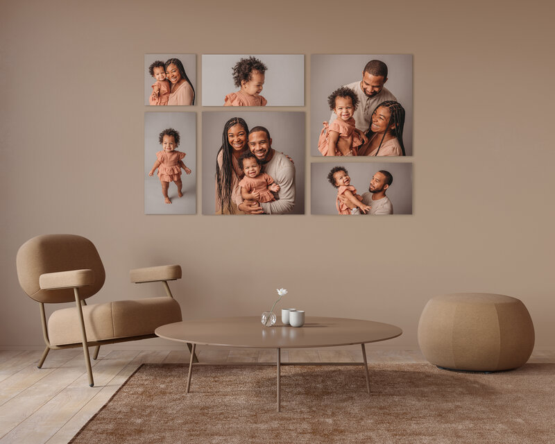 High end living room  with neutral camel tone wall, camel color chair, round coffee table and ottoman, camel and brown color rug and a beautiful wall art display with 6 canvases grouped together on the wall with family portraits on them