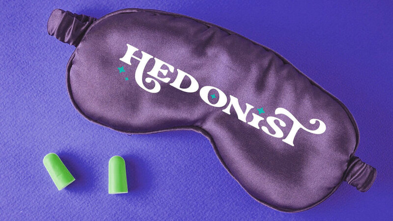 Hedonist Health Purple Sleep Mask with their branding design printed on it