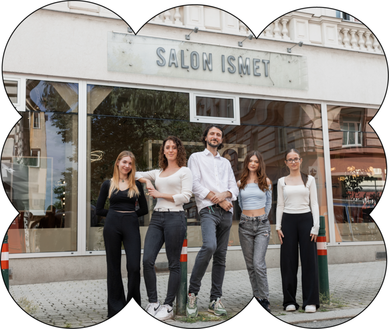 Team of a hair salon standing in front of the salon
