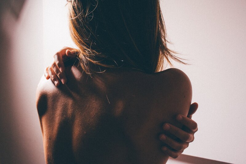 tantric woman holding herself in pleasure, love and truth