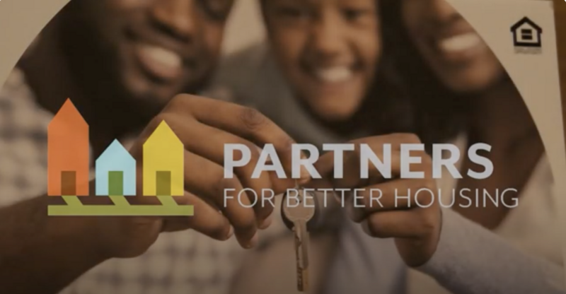 A image of a family of 3 holding house keys behind the partrs for better housing logo