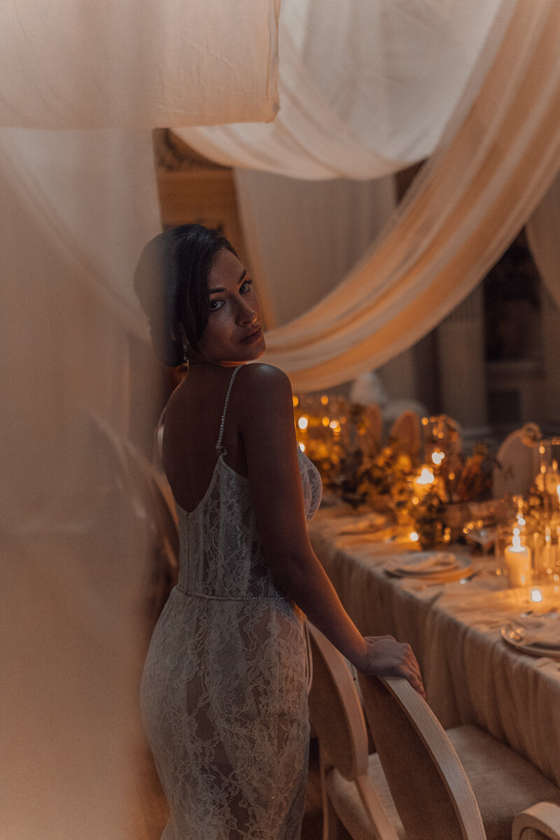 Wedding photographer captures couple taking a stroll hand in hand at their french chateau wedding.