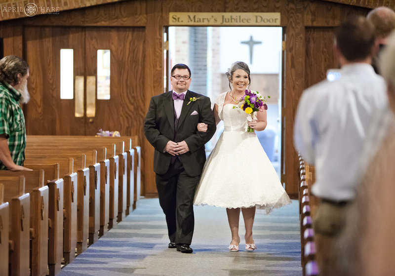 Bride and Father walk down aisle at Saint Mary Catholic Church Greeley