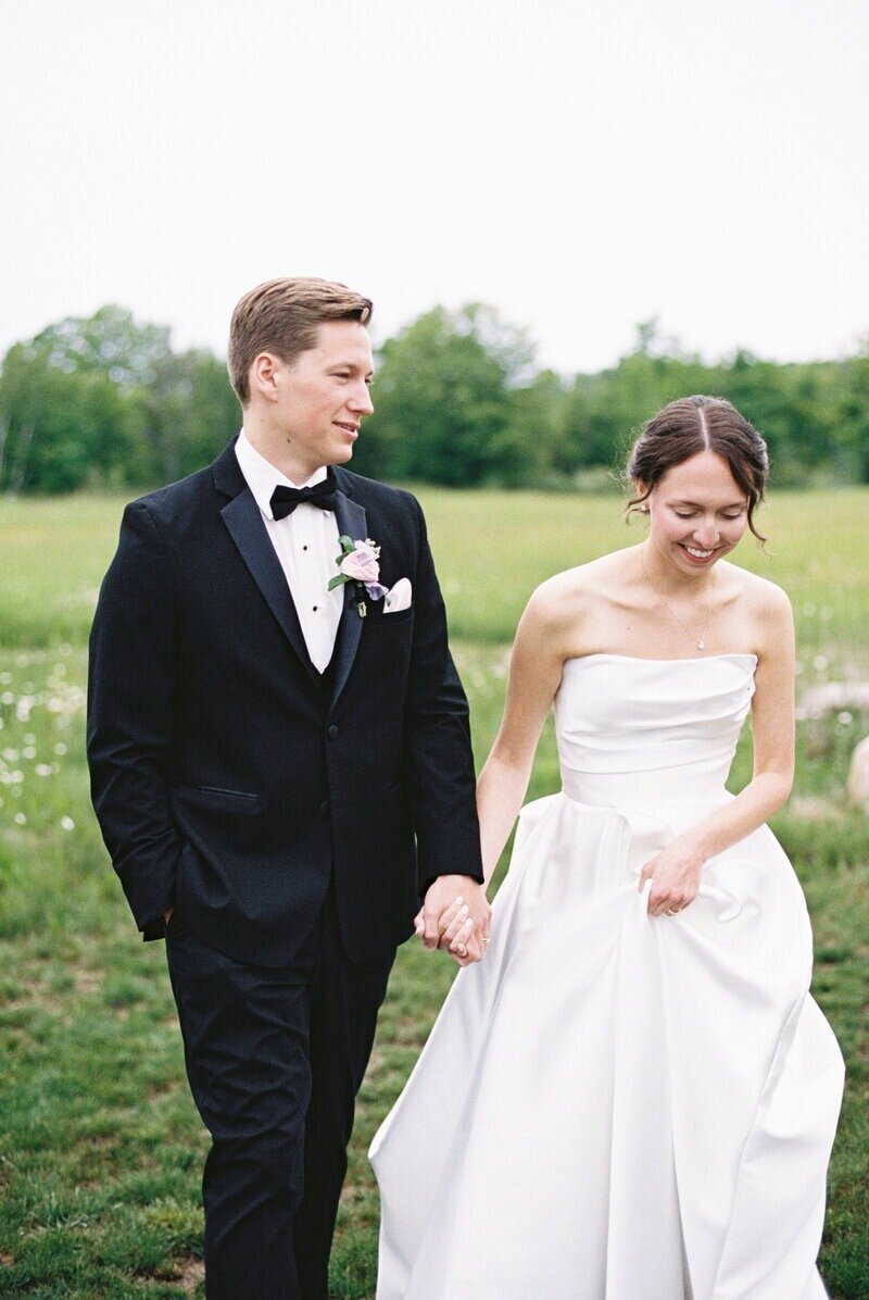 Joyful bride and groom smiling together just after their ceremony, captured by Emily Barbara Milwaukee wedding photographer in a candid moment.
