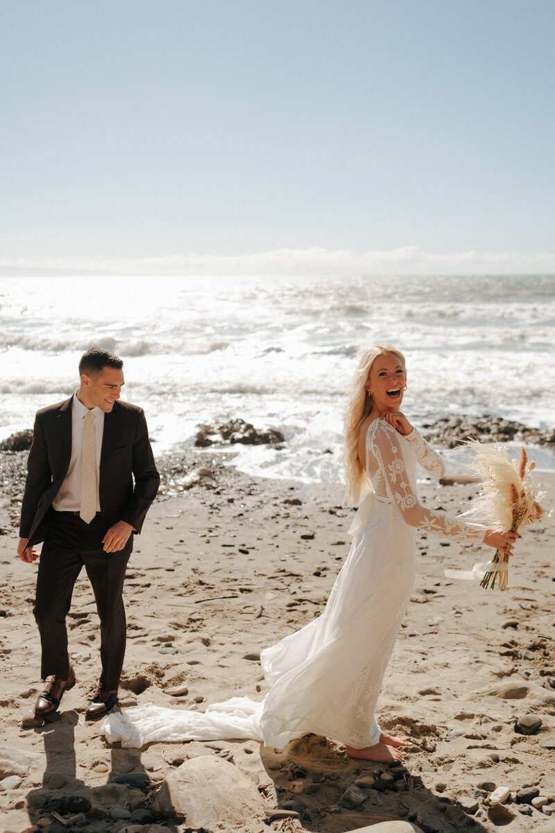 couple running on the beach together