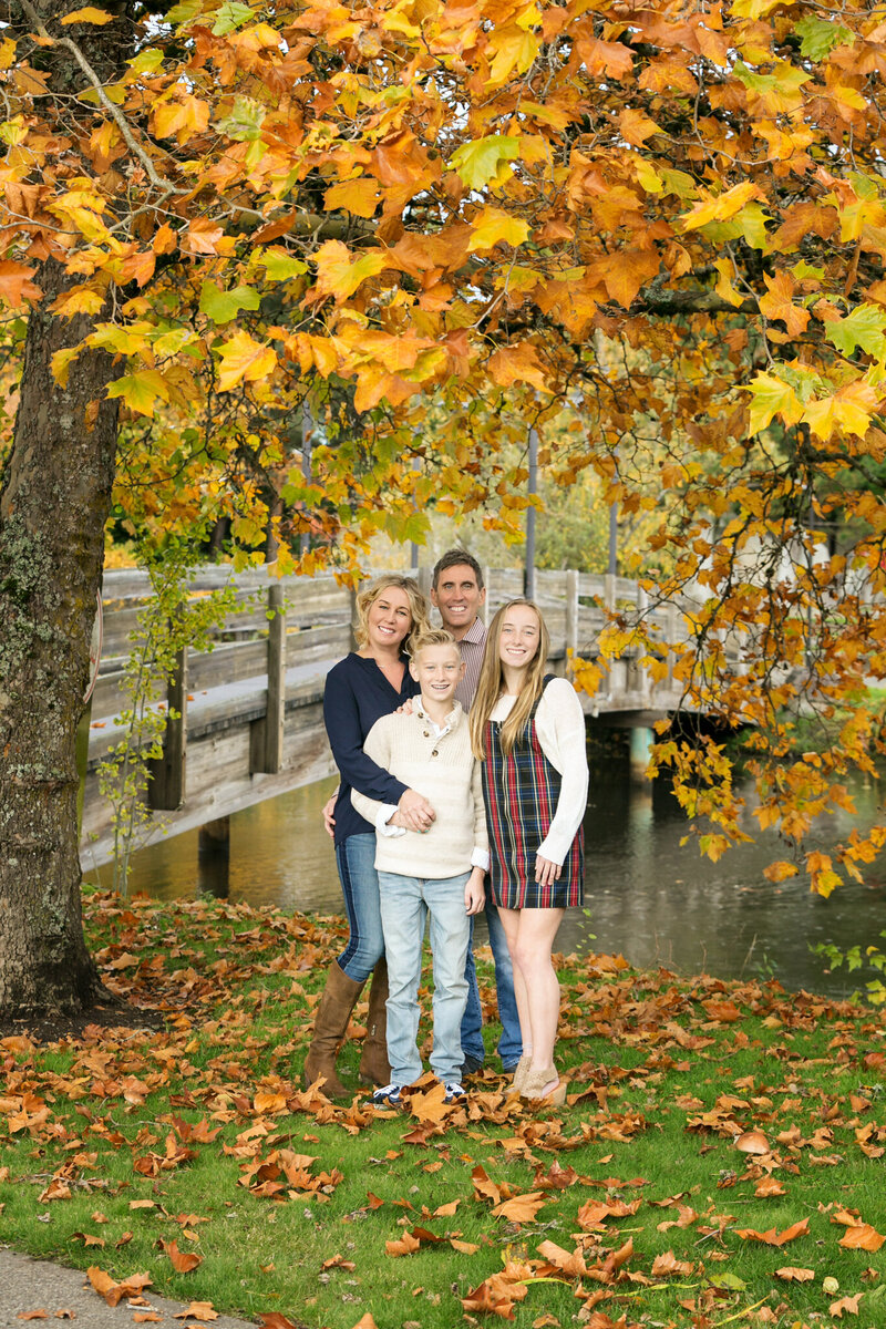 Gorgeous fall family portraits in a park by the river in Seattle Washington