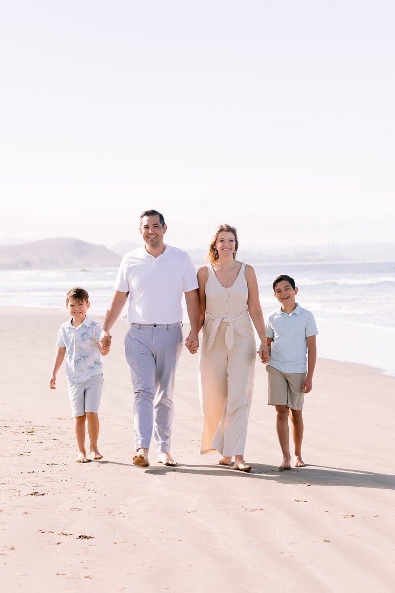 Family walking on the beach in San Luis Obispo